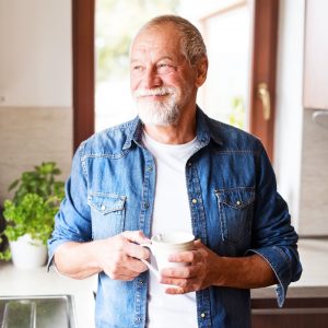 Co-Own for Over 55s: Image of man with a cup of tea