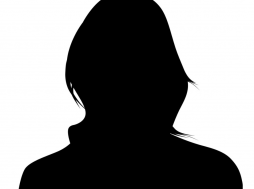 Silhouette of a person with shoulder-length hair facing right.